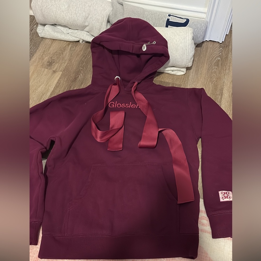 Glossier Maroon Hoodie with Logo
Holiday edition
